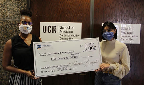 Undocumented health team receiving check