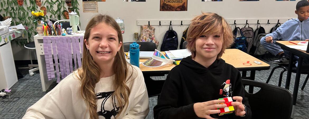 Two Craig School Students working at a table