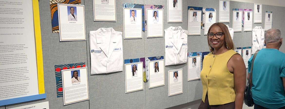 Michelle Burroughs in front of an exhibit