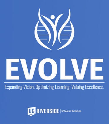 medical students sitting in white coats with the EVOLVE logo superimposed
