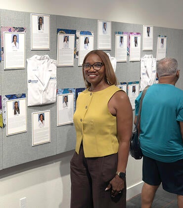 Michelle Burroughs in front of an exhibit