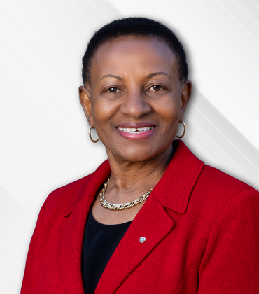Deborah Deas in front of a checked background