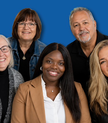 Office of Faculty Development group photo against a blue background