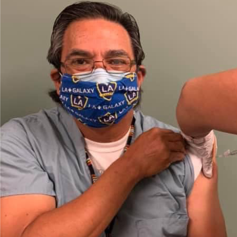 Dr. Javier Sanchez getting vaccinated