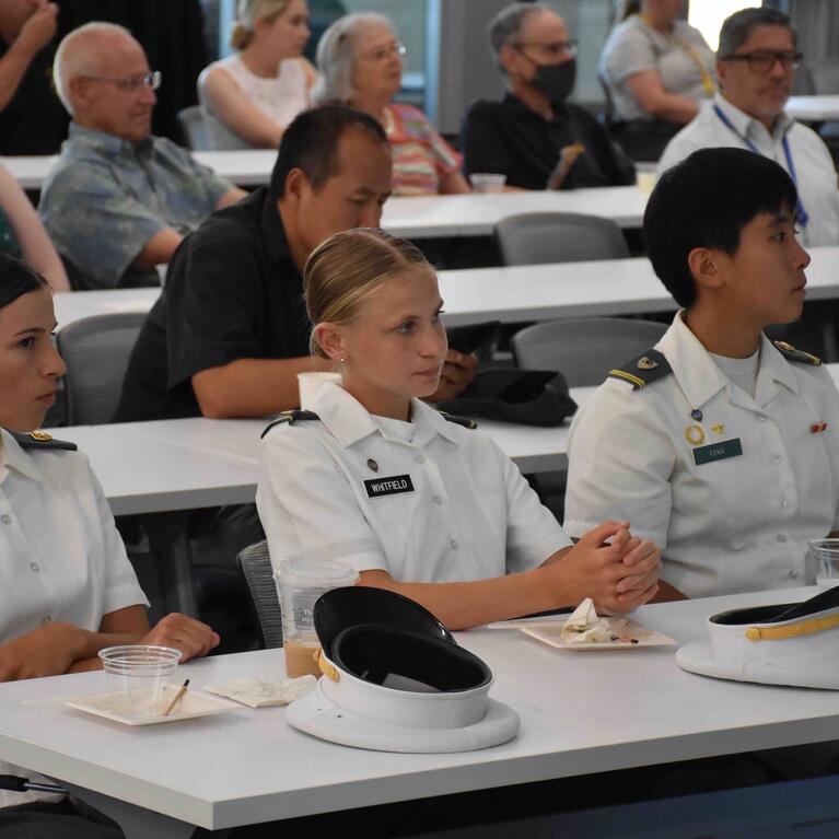 West Point cadets sitting at a table at UCR