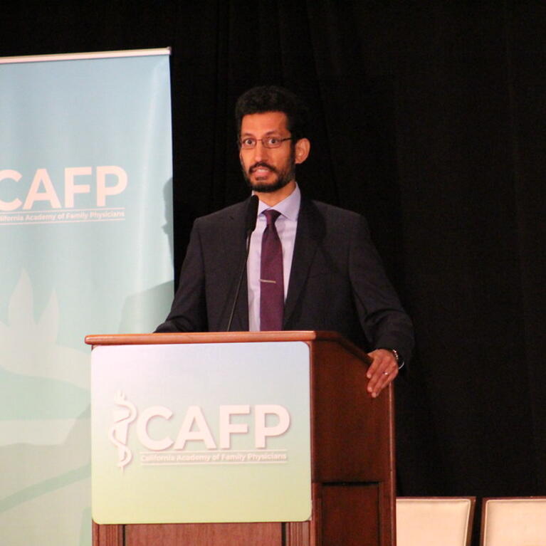 Moazzum Bajwa speaking - Photo by Sonia Olivarez