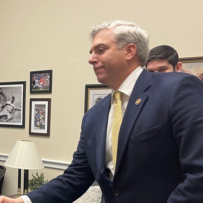 Scott Pegan shaking hands with Representative Gil Cisneros.