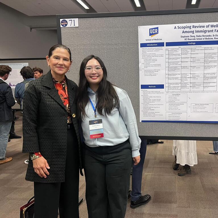 Stephanie Zheng standing in front of a research poster