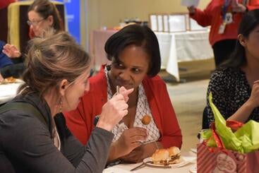Teresa Cofield sitting at a table at an event