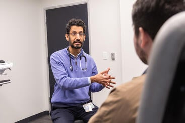 Dr. Bajwa working with a patient at Hulen Place