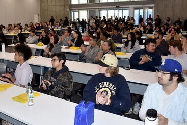 Crowd in Room 104 during opening session