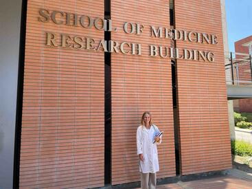 Cadet Audrey Whitfield outside the SOM Research Building