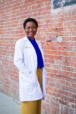 adwoa-osei-600 Dr. Adwoa Osei in front of a brick wall