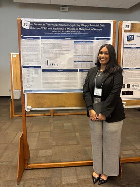 leilani-tull-research Leilani Tull standing in front of her research poster