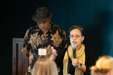 Fortuna sitting holding a microphone