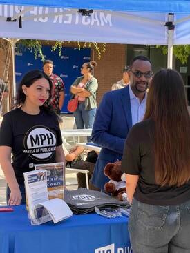 Talking to students at the MPH table at Open House 2026